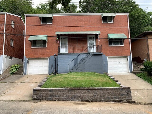 view of front of property with a garage