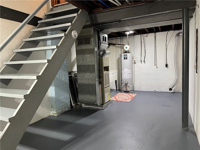 basement featuring gas water heater and heating unit