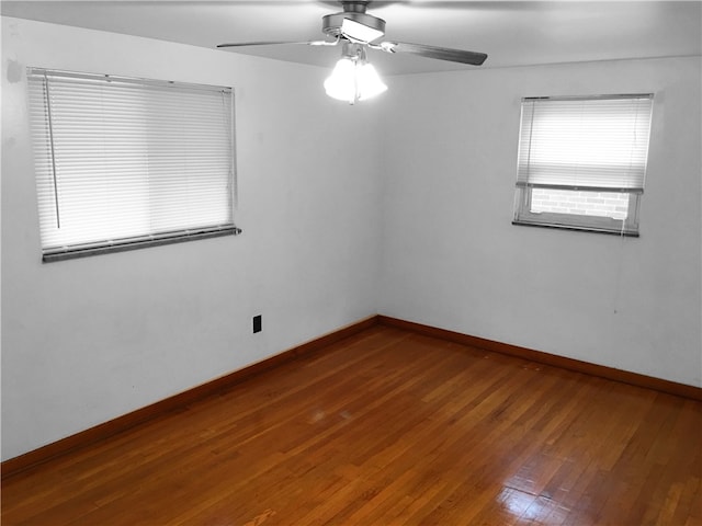 spare room featuring ceiling fan and hardwood / wood-style floors