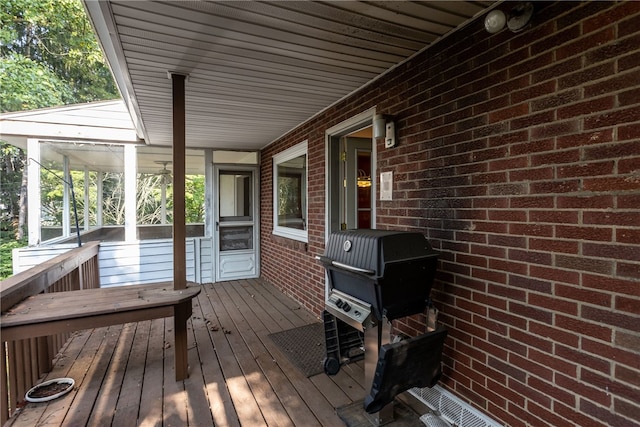 wooden deck featuring area for grilling