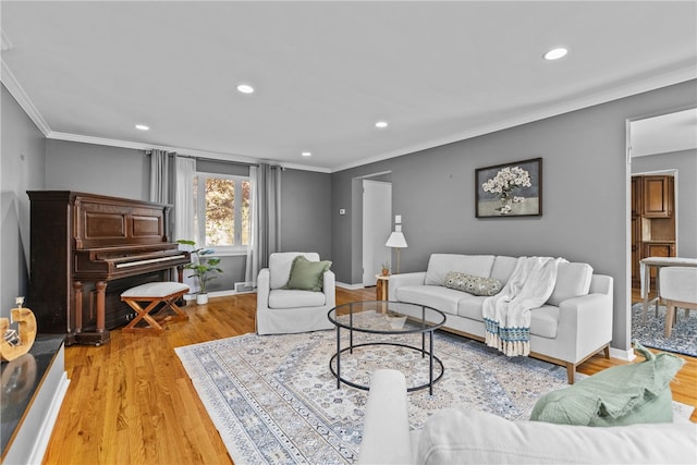 living room featuring ornamental molding and hardwood / wood-style floors