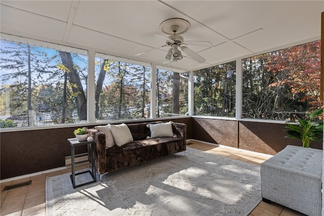 sunroom featuring ceiling fan