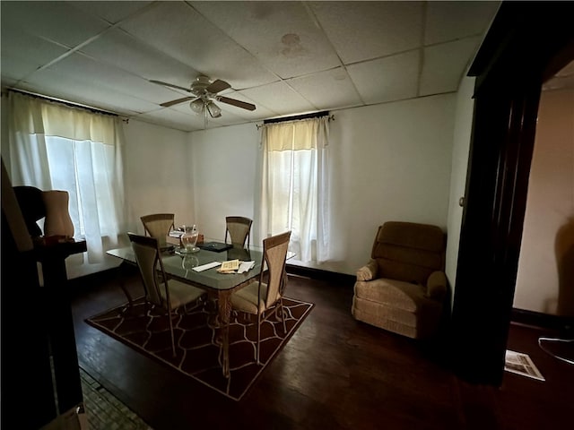 dining room with a paneled ceiling and ceiling fan