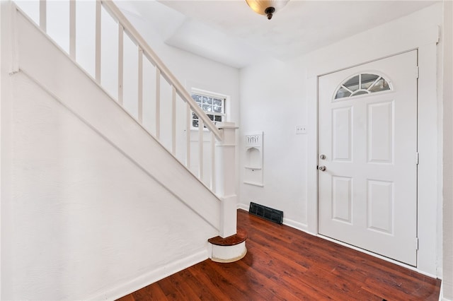 entryway with hardwood / wood-style flooring