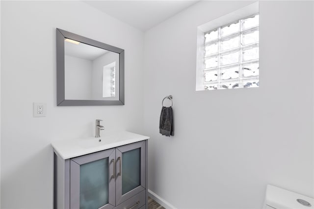 bathroom with vanity and toilet