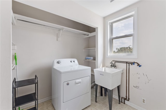 clothes washing area with washer / clothes dryer