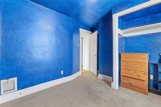 unfurnished bedroom featuring carpet flooring