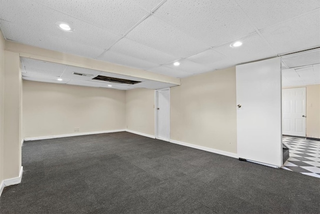 basement featuring dark colored carpet