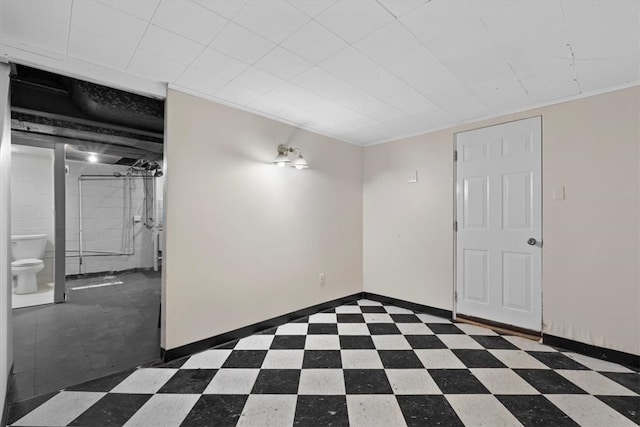 empty room featuring crown molding