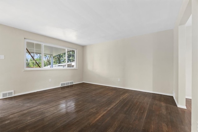 unfurnished room featuring dark hardwood / wood-style floors