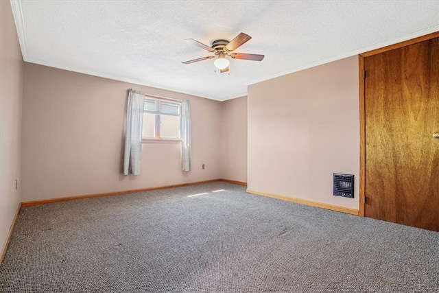 carpeted empty room with crown molding, a textured ceiling, and ceiling fan