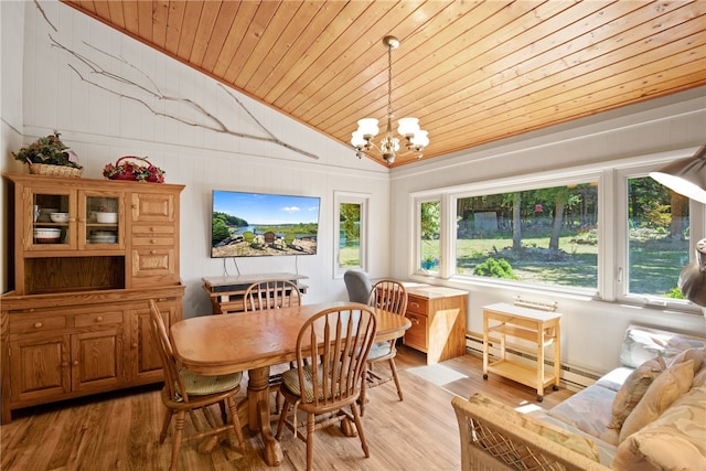 dining room featuring lofted ceiling, wood ceiling, baseboard heating, and light hardwood / wood-style flooring