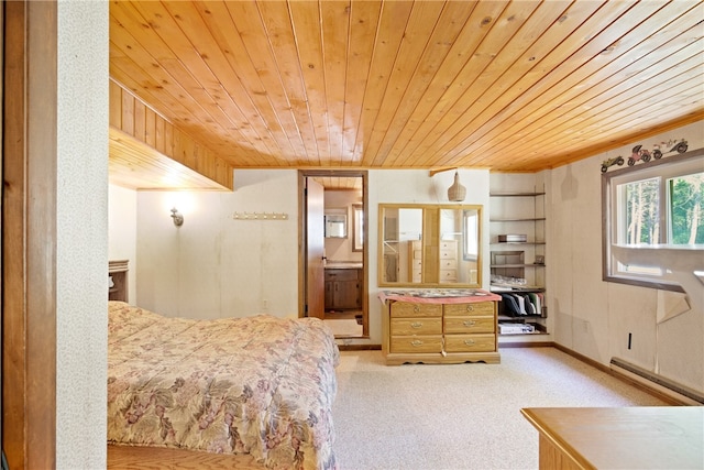 bedroom with a baseboard heating unit, light carpet, and wooden ceiling