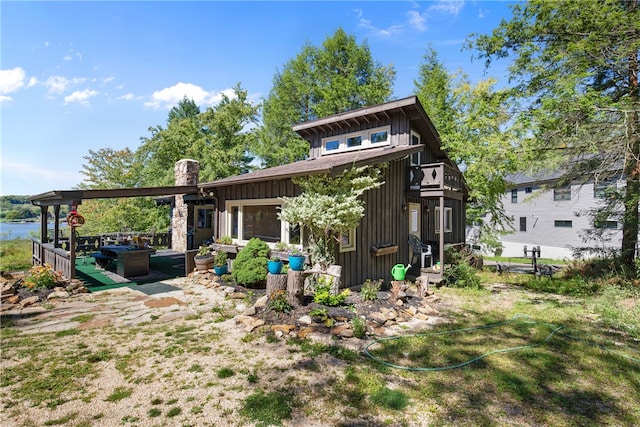 back of house featuring an outdoor hangout area