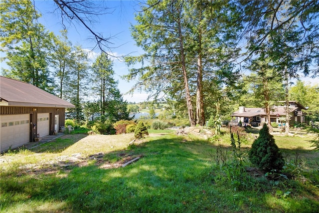 view of yard with a garage