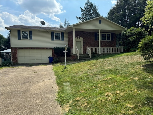 view of front of home with a garage and a front yard