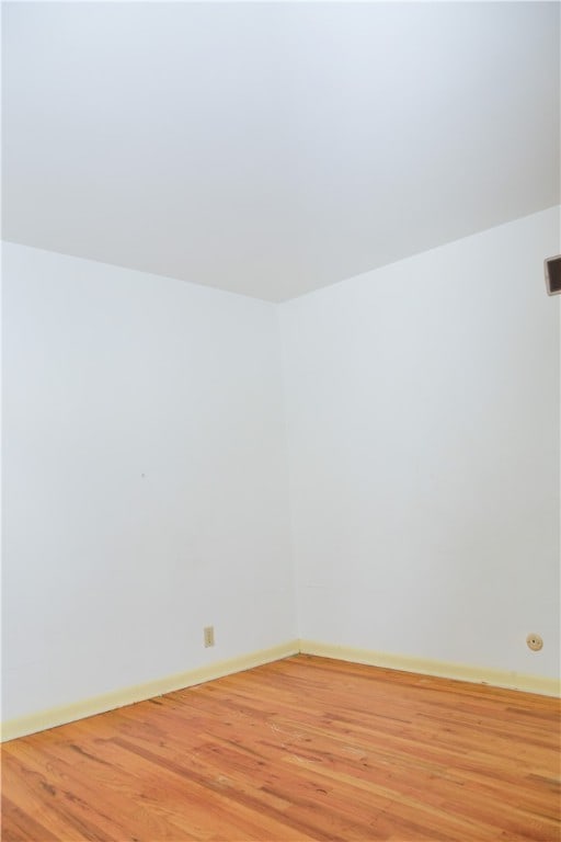 unfurnished room featuring light hardwood / wood-style flooring