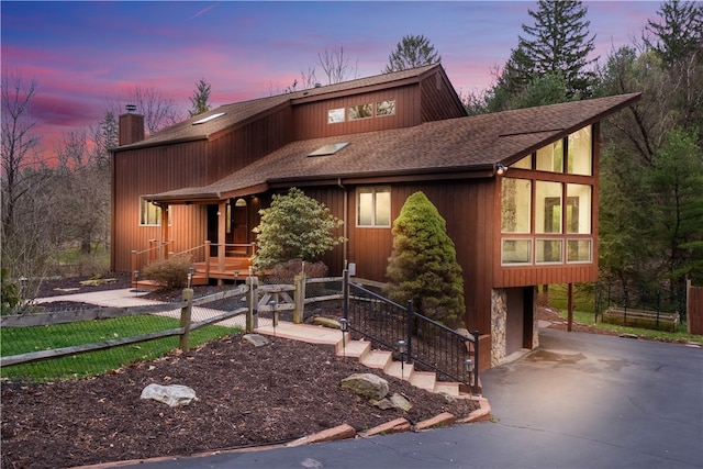 view of front of home with a carport