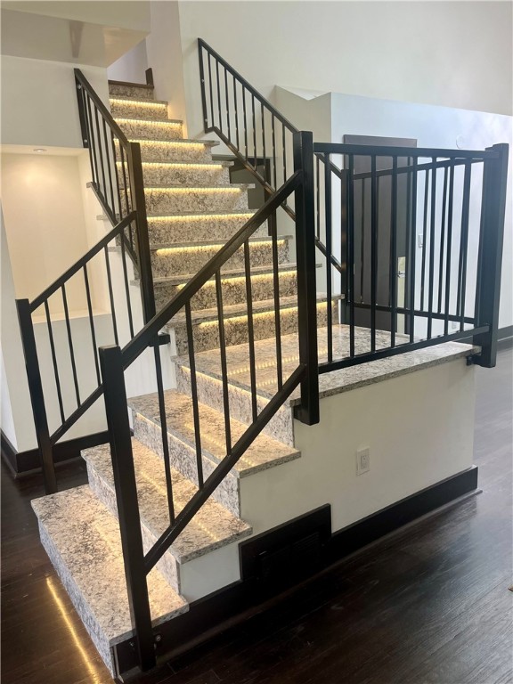 stairs with hardwood / wood-style floors