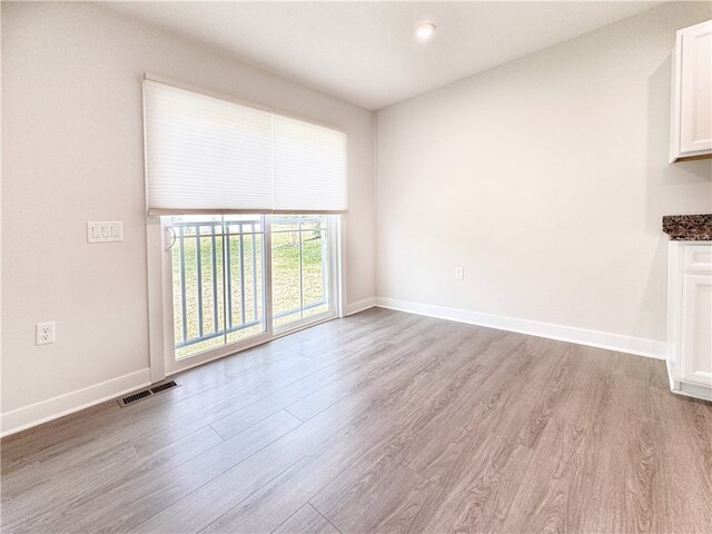 unfurnished living room featuring light hardwood / wood-style floors