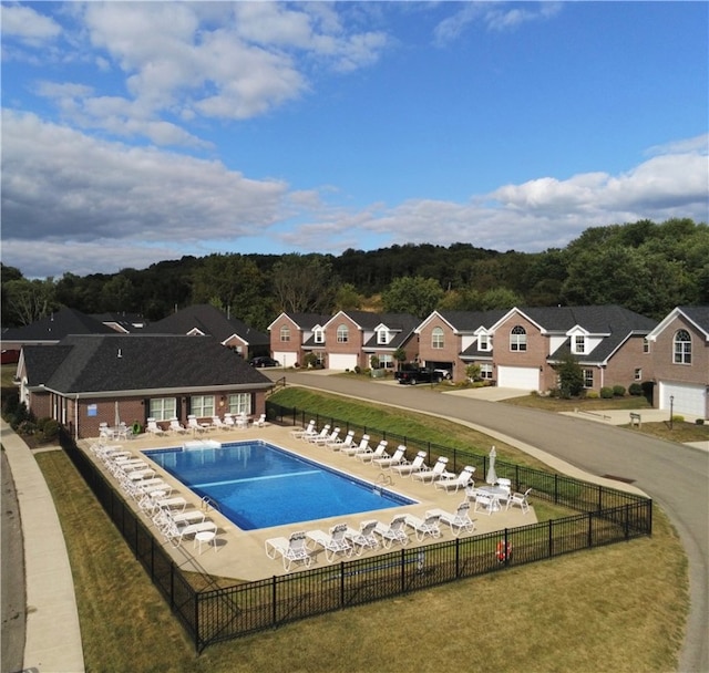 view of pool featuring a yard