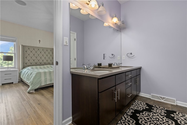 bathroom featuring vanity and wood-type flooring