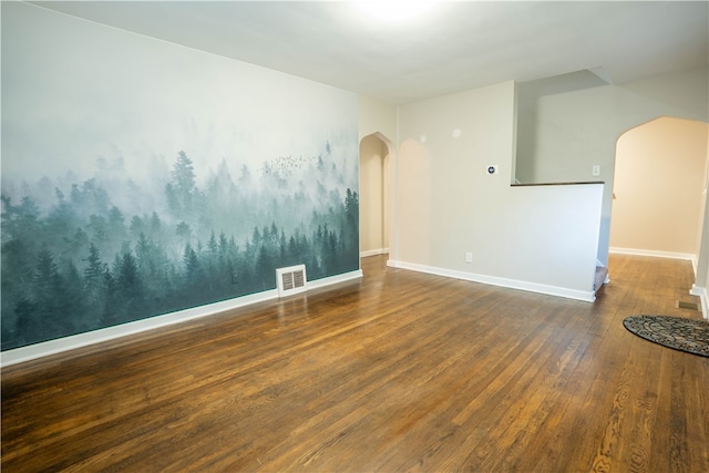 spare room with hardwood / wood-style floors