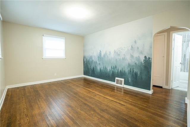 spare room featuring dark hardwood / wood-style flooring