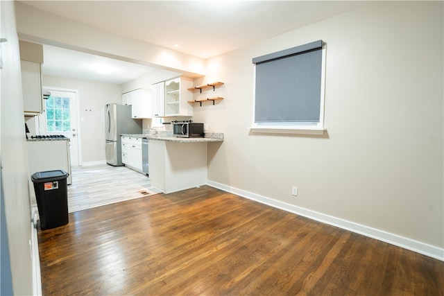 unfurnished living room with light wood-type flooring