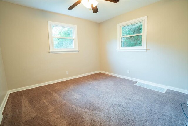 unfurnished room with carpet flooring and ceiling fan