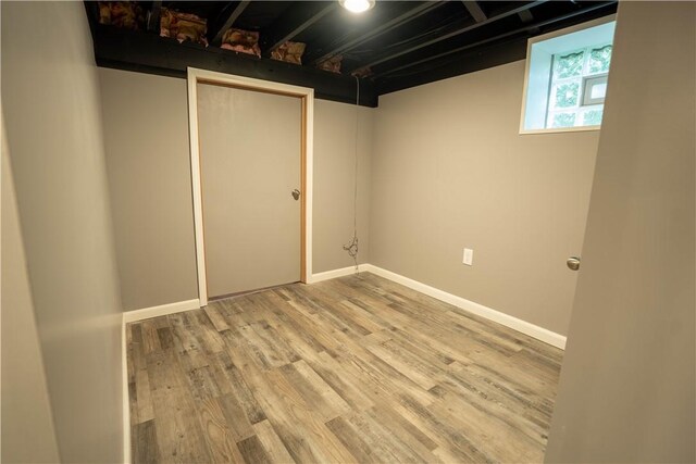 basement featuring light hardwood / wood-style flooring