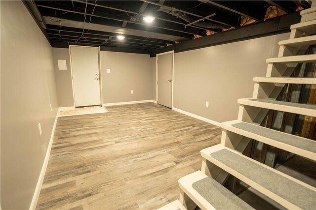 basement with wood-type flooring