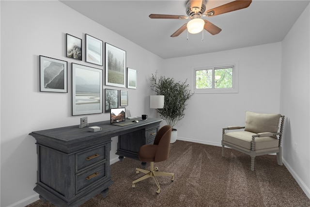 carpeted office featuring ceiling fan and baseboards