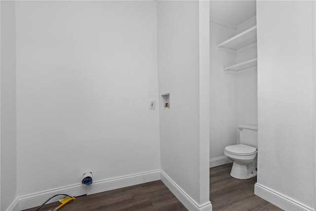 bathroom with wood finished floors, toilet, and baseboards