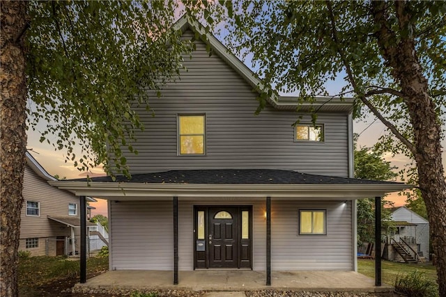 traditional-style house featuring a porch