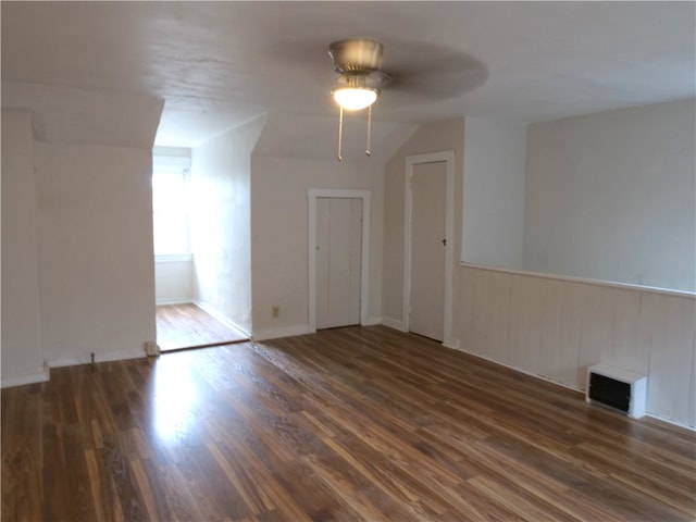 spare room featuring ceiling fan and dark hardwood / wood-style floors