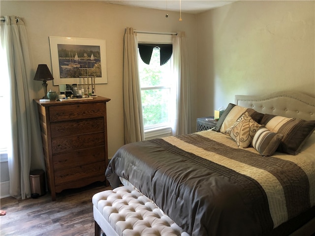 bedroom featuring dark hardwood / wood-style flooring