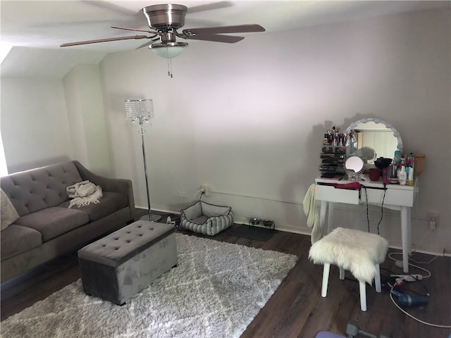 living room with ceiling fan, hardwood / wood-style flooring, and vaulted ceiling