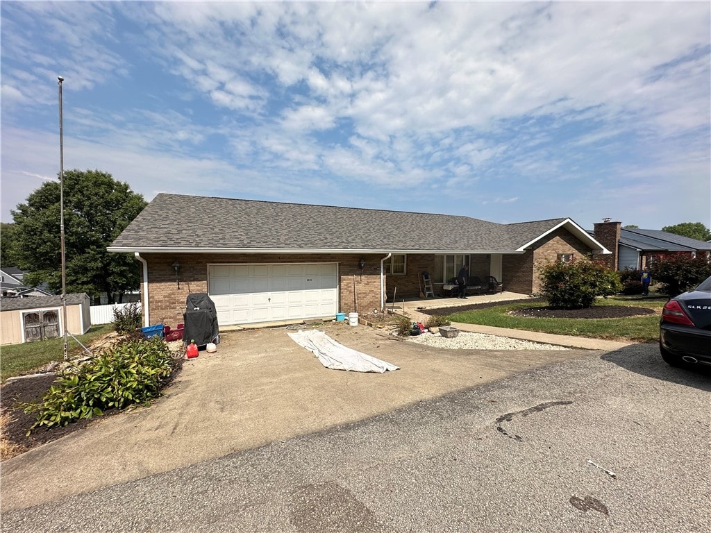 ranch-style house featuring a garage