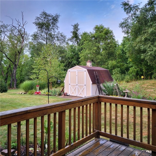 wooden terrace with a yard and a storage shed