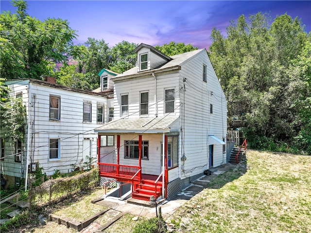 view of front of home with a lawn