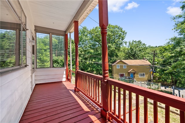 wooden terrace with a porch