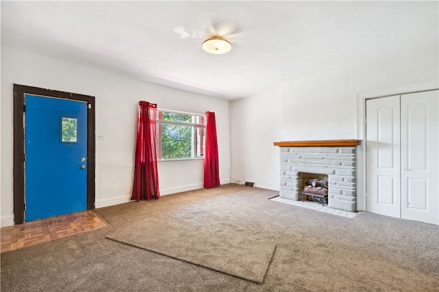 unfurnished living room featuring a fireplace and light carpet