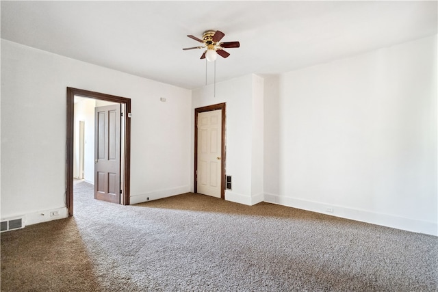 empty room featuring carpet flooring and ceiling fan