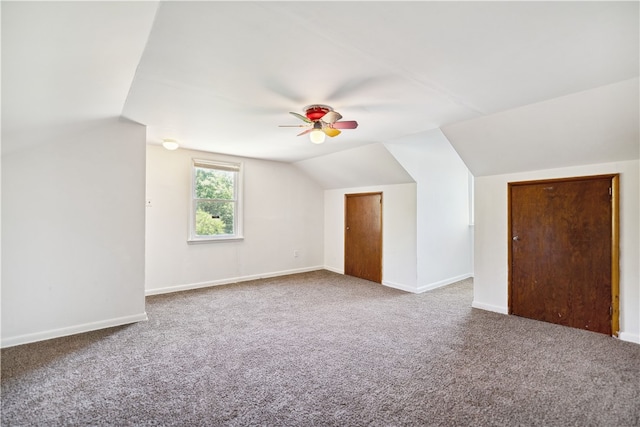 additional living space with lofted ceiling, carpet, and ceiling fan