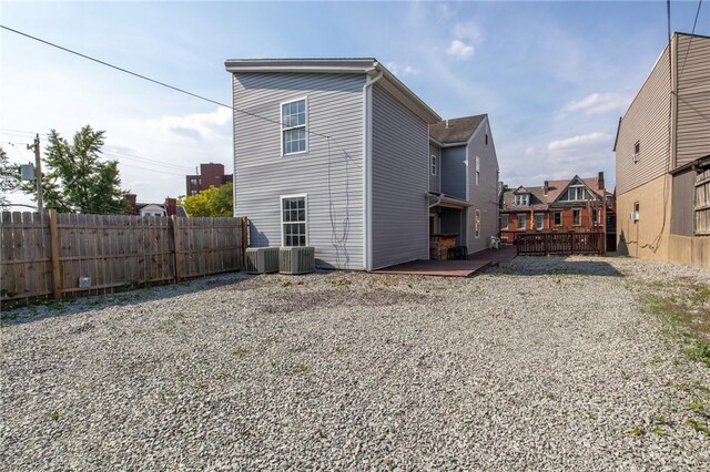 back of house featuring a wooden deck