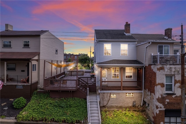 view of front of property with a balcony