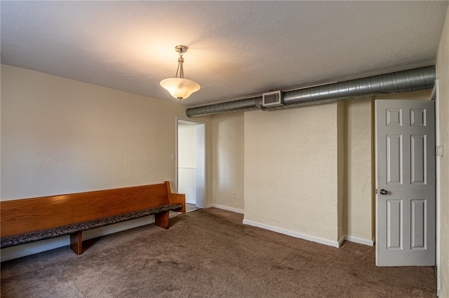 interior space featuring a textured ceiling