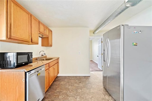 kitchen featuring stainless steel appliances and sink