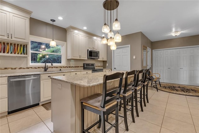 44868 Warner Rd, Pa, PA 16354 - kitchen with stainless steel appliances, a sink, tasteful backsplash, light tile patterned flooring, and recessed lighting